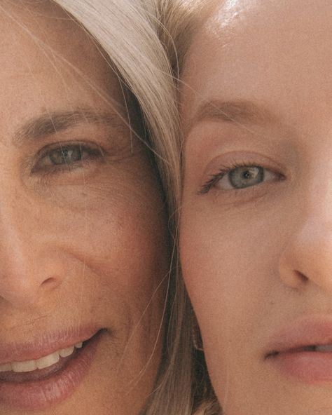 Close-up of a young woman and older woman with radiant skin, touching faces and smiling to show Korean skincare results