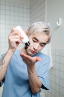 Man putting cleanser in hand